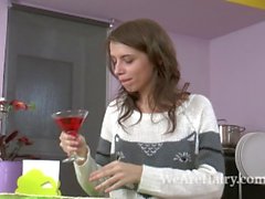 Christy makes a drink and then strips naked